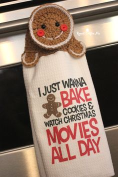 a hand towel with a gingerbread on it that says i just wanna to bake cookies and watch christmas movies all day