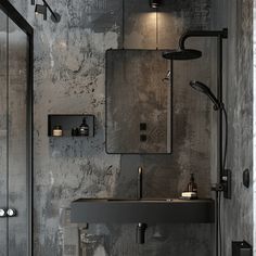 a bathroom with a sink, mirror and shower head mounted to the side of the wall