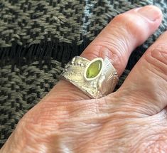 Sterling silver ring has a marquis shaped peridot, size 7, 5/8 inch at widest part. Handmade with silver metal clay Silver Metal Clay, Metal Clay, Rings Statement, Sterling Silver Ring, Statement Rings, Silver Ring, Sterling Silver Rings, Jewelry Rings, Silver Rings