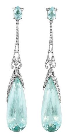 A Pair of Edwardian Platinum, Aquamarine and Diamond Pendant-Earrings, circa 1910. Each surmounted by a pear-shaped aquamarine, joined by a pierced platinum diamond-set filigree link, suspending a drop-shaped aquamarine, approximately 38.00 carats. #Edwardian #earrings Edwardian Earrings, Ruby Rings, Drop Earrings Silver, Edwardian Jewelry, Fantasy Closet, Aquamarine Jewelry, Gemstones Jewelry, Hypoallergenic Jewelry, Long Dangle Earrings