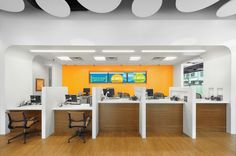 an empty office with desks and chairs