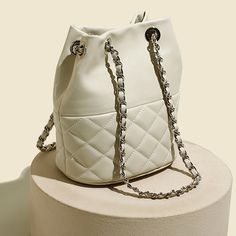 Strike the perfect balance between chic and cool with our quilted bucket bag. Featuring a relaxed, circular silhouette, this roomy piece will ensure that you will have ample space to hold your daily essentials and more with ease. The soft quilted finish is a timeless classic that will never go out of fashion — it will also add visual interest to your look. Pair it with a white lapel blouse, tapered jeans and loafers.Weight: 460 gWidth (cm): 18 cmHeight (cm): 22.5 Color: WhiteInterior Material: C Luxury Bucket-shape Shoulder Bag For On-the-go, Luxury Bucket Shape Shoulder Bag For On-the-go, Chic Cream Quilted Shoulder Bag, Trendy Quilted Pouch Shoulder Bag, Chic Quilted Tote Bags, Chic Quilted Shopping Bag, Chic Quilted Travel Bags, Chic Quilted Shoulder Bag, Chic White Quilted Bag