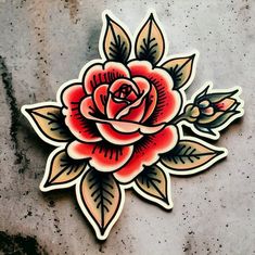 a sticker depicting a rose with leaves and buds on the side of a concrete surface