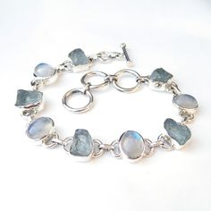 Natural Aquamarine & Rainbow moonstone 925 Sterling Silver Bracelet, Multi stone Bracelet, Gemstone Bracelet, Royal Handmade Bracelets, Product:- Ring Modal no:- U212 Metal:- 925 Sterling Silver Gemstone :- Aquamarine & Moonstone Gemstone size:- 10x12 mm Finishing:- Shiny silver We are using Pure 925 (Stamped) Sterling Silver with Natural Gemstone Jewelry, all of our jewelry designs are Handmade. We are adding new creative designs in our store regularly, for new handmade stuff please get Luxury Silver Moonstone Gemstones, Luxury Polished Sterling Silver Gemstones, Luxury Classic Sterling Silver Gemstones, Elegant Luxury Silver Gemstones, Cheap Handmade Silver Crystal Bracelet, Luxury Silver Moonstone Bracelets, Sterling Silver Bracelet With Gemstone And Moonstone, Silver Bracelets With Natural Moonstone, Silver Moonstone Bracelet With Natural Stones