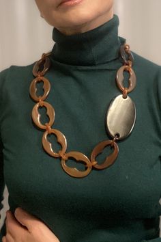 This brown  statement necklace is a modern accessory to wear on any occasion a superb anniversary gift for wife, adding a touch of contemporary elegance to her outfit.  The necklace is made of natural sustainable material, horn in brown colour, all hand made Size: 71 cm (27.9"), each link is about 5 cm (1.9"), the black connector (horn) is 8 cm (3") oval shape. Horn links are considered ecological because they are used from renewable resource and are biodegradable. My style is very wearable and Modern Brown Jewelry For Parties, Chic Brown Jewelry For Party, Chic Handmade Chain Necklace For Gift, Chic Handmade Chain Necklace Gift, Elegant Handmade Brown Necklace, Elegant Brown Chain Necklace As Gift, Chic Brown Handmade Jewelry, Chic Handmade Brown Jewelry, Chic Brown Formal Jewelry