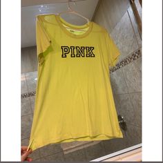 Brand New Without Tags. Neon Yellow Victoria Secret T-Shirt With Black Writing. No Stains. Pet And Smoke Free Home. Trendy Yellow T-shirt With Letter Print, Yellow Sporty T-shirt With Letter Print, Casual Yellow T-shirt With Letter Print, Yellow Crew Neck T-shirt With Logo Print, Yellow Crew Neck T-shirt With Text Print, Neon Yellow Cotton T-shirt For Spring, Yellow Graphic Tee With Letter Print, Trendy Yellow Top With Text Print, Yellow Short Sleeve Top With Letter Print