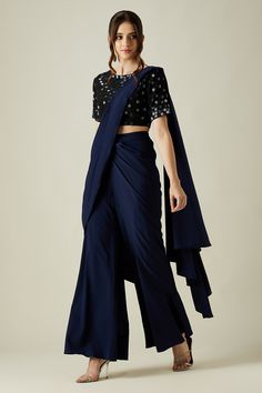 Midnight blue cotton silk palazzo saree with draped pallu. Paired with black round neck blouse with metallic crystal work embellishment.
Component: 2
Pattern: Embellished
Type Of Work: Metallic Crystal Work
Neckline: Round
Sleeve Type: Half Sleeves
Fabric: Cotton Silk
Color: Blue
Other Details: 
Blouse: Back keyhole loop button
Occasion: Cocktail,Sangeet - Aza Fashions Palazzo Saree, Crystal Work, Round Neck Blouse, Blouse Back, Drape Saree, Embellished Blouse, Power Dressing, Blouse For Women, Blouse Online