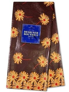 a brown tie with yellow flowers on it