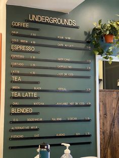 there is a sign on the wall that says undergrounds and coffee espresso