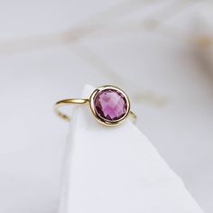 14K Elegant solid gold ring handcrafted with a genuine purple amethyst, beautiful by itself or stacking. A dainty minimalist ring for yourself or someone who deserve your love. An excellent choice for anniversary gift or birthday Mother's Day gift. Amethyst is the birthstone of February. 100% handcrafted with love!D E T A I L S● Metal: 14K solid gold or 14K white gold or 14K rose gold● Gemstone: Amethyst purple, briolette cut ● Stone Diameter: 8mm (0.3in) or 10mm (0.4in) or 12mm (0.5in).R I N G Elegant Faceted Amethyst Ring In Yellow Gold, Elegant Yellow Gold Amethyst Ring With Bezel Setting, Fine Jewelry 14k Gold Amethyst Ring With Round Cut, Faceted Amethyst Ring In Yellow Gold Fine Jewelry, Elegant Faceted Sapphire Ring, Elegant Faceted Ruby Ring, Elegant 14k Gold Amethyst Ring With Bezel Setting, Elegant Faceted Round Ruby Ring, Modern Yellow Gold Amethyst Ring Gift