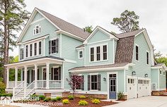 a large blue house with lots of windows