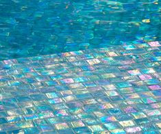 an empty swimming pool with clear blue water