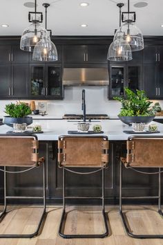 Modern Farmhouse kitchen including matte black cabinets, industrial pendant lighting, and leather counter chairs. Painting Ideas Dark, Matte Black Cabinets, Kitchen Islands With Seating, Islands With Seating, Kitchen Island Seating, Kitchen Black Counter, Modern Farmhouse Kitchen Ideas, Black Pendant Light Kitchen, Sleek Kitchen Design