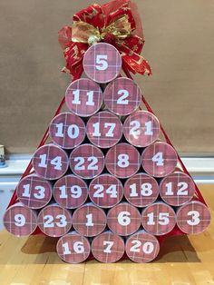 a christmas tree made out of toilet paper with numbers on it