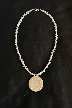 This stunning necklace features an AAA+ Fossil Jasper Stone pendant, beautifully paired with lustrous pearls. The design is minimalist yet impactful, blending boho charm with classic sophistication. Perfect for layering or wearing on its own, this necklace is an ideal gift for your mother or a timeless addition to your jewelry collection. **Materials** *small pearls 3mm *Exquisite fossil jasper stone pendant  *silver findings  Necklace length is 18 inches. **Description** This delicate necklace, Timeless Gifts, Jasper Pendant, Necklace Boho, Jasper Stone, Pendant Silver, Stunning Necklace, Minimalist Necklace, Delicate Necklace, Stone Pendant