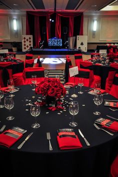 a banquet room with red and black decor