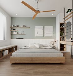 a large bed sitting under a ceiling fan in a bedroom next to a book shelf