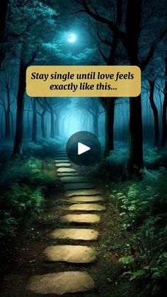 a path leading through a forest with the words stay single until love feels exactly like this