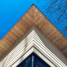 the corner of a house with a blue sky in the background