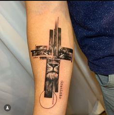 a cross with a lion on it and the word jesus written below it is in black ink