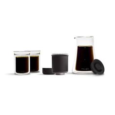 three different types of coffee in glass containers