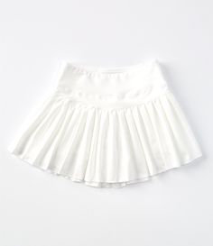 From GB Girls&#x2C; this skirt features:Solid Mid-risePull-on stylingMini lengthBuilt-in shortsPleated detailingRounded hemlineAthleisure silhouettepolyester/spandexMachine wash/tumble dryImported. Girly Skirts, Activewear Skirt, Carpenter Outfits, Sabrina Carpenter Outfits, Preppy Skirt, Preppy Inspiration, White Tennis Skirt, Dream List, Preppy Clothes