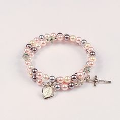 Pure of Heart   Hand-crafted rosary bracelets   https://ourladysrosegarden.com/product/pure-of-heart #RosaryBracelets Pink Pearl Jewelry With 8mm Beads, Pink Spiritual Jewelry For First Communion, Elegant Pink Rosary Bracelet For Wedding, Elegant Pink Wedding Rosary Bracelet, Pink Beaded Spiritual Rosary Bracelet, Adjustable Silver Rosary For Mother's Day, Elegant Pink Bracelets For First Communion, Pink Pearl Bracelets For Mother's Day, Pink Beaded Jewelry For First Communion