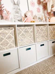 baskets are lined up on the shelves in this children's playroom with stuffed animals and toys