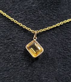 1. 18k Gold Citrine Quartz Pendant 2. Made to Order 3. Gemstone - Citrine Quartz 4. Jewelry Type - Pendant 5. Total weight - 0.980 Gram Approx 6. Citrine Weight - 3.60 Carats 7. Shape - Octagonal 8. Gold Weight - 0.260 Grams Approx. 9. Gold Purity - 18k 10. Citrine Size - 8 × 10 mm Approx. 11. Cut - Emerald 12. Ready to dispatch in 1 - 2 days. 13. Handmade Items 14. AAA Quality Pendant 15. 1 Quantity Available 16. Chain is not inclusive Pictures are taken under natural and day light. Faceted Yellow Gold Pendant Jewelry, Yellow Gold Diamond Cut Rectangular Pendant Necklace, Faceted Yellow Gold Jewelry For Anniversary, Yellow Gold Necklace With Emerald Cut Bezel Setting, Yellow Gold Faceted Jewelry For Anniversary, Dainty Emerald Cut Yellow Gold Jewelry, Yellow Gold Emerald Cut Necklace With Bezel Setting, Yellow Gold Emerald-cut Necklace With Bezel Setting, Formal Faceted Yellow Gold Jewelry