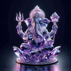 an intricately designed glass figurine of the hindu god ganesh