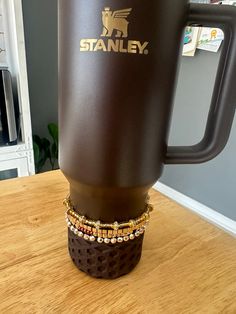 New! Handmade beaded stackable stretch boot topper bracelets for your favorite tumblers. Looks great on Stanley's and I've customized them to match your favorite colors! This set looks perfect with the chocolate Stanley or any of the gold tumblers. Listing is for 4 bracelets. Cup and boot are not included! Fits 40 & 30 oz Tumblers Bracelets will slide on and stay in place with the cups silicone boot. There has been no problem with scratching of cups. Bracelets are made of a strong elastic. Just use caution to not overstretch them. Stacked Bracelets, Gold Tumbler, Boot Bracelet, Boot Toppers, Christmas Bracelet, How To Stretch Boots, Slide On, Bracelet Stack, Arm Band