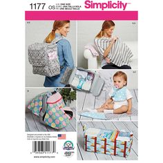 a woman holding a baby in her back pack and wearing a bib with the words simpl city written on it