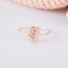 "♥ Birthflower Ring For Mom ♥ Personalized with a birth flower on the front and a message on the back, this dainty ring is a meaningful gift for your loved one on their birthday or any special days. P R O D U C T ∙ I N F O * Material: Solid 925 Sterling Silver * Finishing: Silver - Yellow Gold - Rose Gold * Dimensions: Oval shape measures approx. 5/16\" x 3/8\" (7,5x 10mm) H O W * T O * O R D E R 1. Select the drop-down option you want 2. Please let us know the following information in the \"Add Delicate Birth Flower Promise Ring, Dainty Birth Flower Promise Ring, Dainty Flower Ring With Birth Flower, Dainty Flower Ring With Birth Flower Detail, Personalized Rose Gold Flower Ring For Wedding, Rose Gold Rings With Birth Flower, Rose Gold Round Ring With Birth Flower Detail, Rose Gold Round Ring With Birth Flower, Delicate Birth Flower Wedding Ring