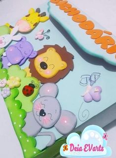 a close up of a cake with animals on it