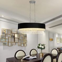 a chandelier hanging from the ceiling in a dining room