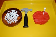 a yellow tray with red and white play food on it, including a spatula