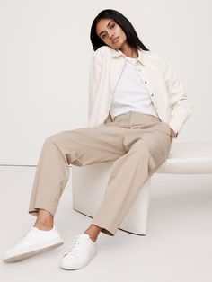 Reach for these pants when your schedule calls for all-day comfort—we kept the silhouette casual, adding a concealed elastic waistband at back for a custom fit.  Here, we cut this pant in a luxuriously soft, buttery feeling blend of TENCEL™ lyocell and organic cotton.  Relaxed Tapered fit: High rise (11") with a relaxed fit through the thigh and tapered leg.  Ankle length.  Sustainability: Made with certified organic cotton and TENCEL™ lyocell, a sustainably sourced fiber from responsibly-harves Relaxed Fit High-waisted Wide Leg Pants For Business Casual, High-waisted Wide Leg Pants For Business Casual, Effortless Relaxed Fit Straight Leg Pants, Effortless Pants With Loosely Fitted Hips And Tapered Leg, Relaxed Fit High-waisted Chinos For Everyday, Versatile Relaxed Fit Chinos For Work, Relaxed Straight Leg Work Pants, Spring Versatile Relaxed Fit Dress Pants, Effortless Workwear Bottoms With Elastic Waistband