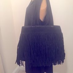 -Large Black Suede Fringe Tote With Several Pockets Inside. -Canvas Lining. Never Used. -Strap To Bag Aprox 11 1/2" -Bag Depth Aprox 13 1/2" -W 19 1/2" @ Full Open Aprox 14" When Snapped Sides -Price Reflects Condition Of Bag/ -Shipping May Be Additional As Bag Is Heavy Item. Reasonable Offers Considered & Welcome!! -Lowballing Ignored Chic Fringe Hobo Bag, Black Fringe Bag For Shopping, Chic Black Bag With Fringe, Chic Black Fringe Bag, Black Fringe Shoulder Bag For Shopping, Elegant Black Shoulder Bag With Fringe, Elegant Black Fringe Shoulder Bag, Evening Black Shoulder Bag With Fringe, Black Fringe Shoulder Bag For Evening