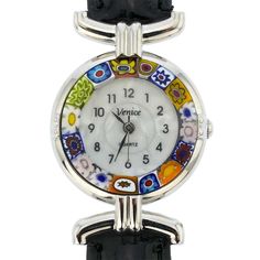 This elegant Murano glass watch is a unique timepiece featuring high-quality workmanship and the most famous Murano technique- Millefiori (a thousand flowers)- which has become a trademark of Murano glass making. Stylized flowers in beautiful colors grace the hand-made face of this watch and give it a trendy and unmistakably Venetian look. This Murano watch adds a perfect accent to any wardrobe and works equally well for your casual outing or a night on the town. The face of this Murano glass wa Elegant Multicolor Round Dial Watches, Murano Glass Jewelry, Genuine Leather Bags, Venetian Glass, Elegant Accessories, Office Accessories, Leather Band, Glass Jewelry, Murano Glass