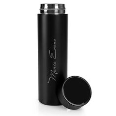 thermos bottle is shown with its lid open and it has a black cap