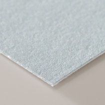 a close up view of the surface of a sheet of white paper on a table