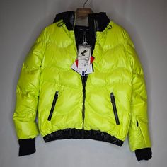 New With Tags, Sportalm Kitzbuhel Ultra Neon Ski Jacket In Pastel Lime, Various Women's Sizes Description This Winter Jacket Is Perfect For Any Outdoor Activity. Its Generous Hood Is Lined With A Plush Material To Keep You Warm In Any Weather. The Width Is Adjustable With A Drawstring, And The Down Chambers Are Quilted In Waves For A Casual Style. There Are Two Zippered Pockets On The Front, And The Hem Is Fitted With A Narrow Cuff And A Soft Elastic Band Inside. The Sleeves Close With A Soft Cu Yellow Outerwear For Winter Sports, Long Sleeve Skiing Outerwear For Winter, Designer Green Winter Outerwear, Winter Skiing Outerwear With Long Sleeves, Yellow Winter Sports Outerwear, Fitted Long Sleeve Skiing Outerwear, Red Long Sleeve Outerwear For Ski Season, Red Sporty Outerwear For Skiing, Red Winter Skiing Outerwear