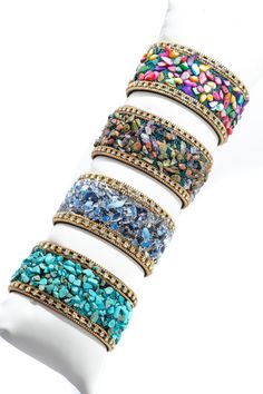 Our Gravel Beaded Bracelet displays vivid stones in the middle resembling gravel and has tiny colorful beads mixed in around them. The bracelet also features small crystals with dainty gold chains on either side and soft suede on the back, making it comfortable to wear all day. The colorful gravel beads will quickly make this bracelet your go-to way to add color to your outfit this spring and summer. Size: 7.75" x 1.25" Magnetic Clasp Spring Gold Beaded Bracelets With Colorful Beads, Trendy Turquoise Bracelets For Party, Bohemian Multicolor Beaded Bracelets For Spring, Spring Beaded Bracelet For Parties, Bohemian Turquoise Bracelet For Party, Bohemian Party Wrap Bracelet With Colorful Beads, Bohemian Adjustable Jeweled Bracelet, Gold Beaded Bracelets For Summer Parties, Bohemian Wrap Bracelet With Colorful Beads For Party