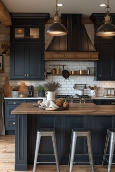 a kitchen with two stools and an island in front of the stove top oven