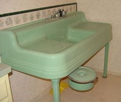 a green sink and toilet in a bathroom