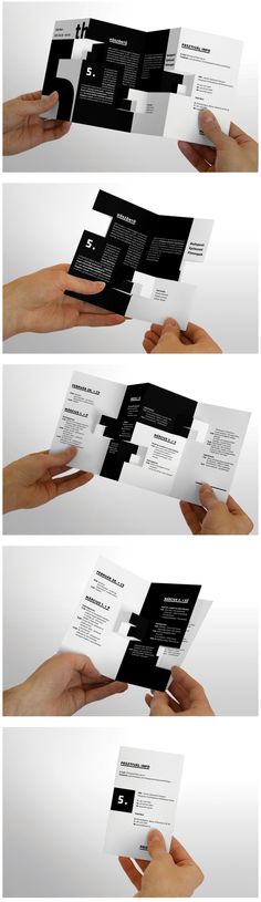 four different types of business cards being held in one hand and folded on the other