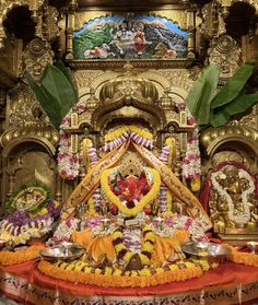 the idol is decorated with flowers and other decorations