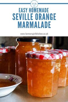 several jars filled with orange marmalade sitting on top of a table