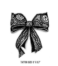 a black lace bow is shown on the back of a white card with text that reads tattoo