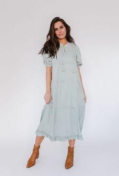 Jazmine Dress in Sage – GabyVer Spring Fringe Maxi Dress, Casual Tassel Maxi Dress For Spring, Spring Maxi Dress With Tassel Ties, Modest Embroidered Spring Dresses, Casual Short Sleeve Dress With Tassel Ties, Spring Midi Dress With Tassels, Maternity Dresses With Ruffle Hem For Spring, Spring Bohemian Midi Dress With Fringe, Spring Bohemian Fringe Midi Dress